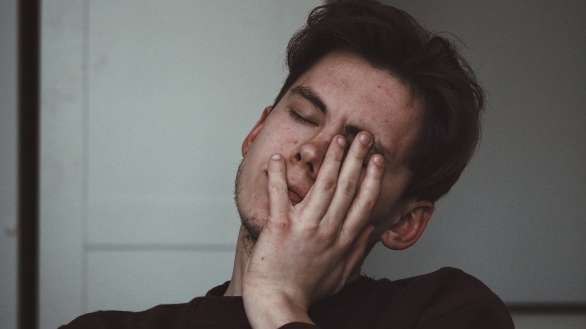 Man wearing black crew-neck top. — a Sleep Finally guide to Tired All Day Wired at Night: Breaking the Loop.