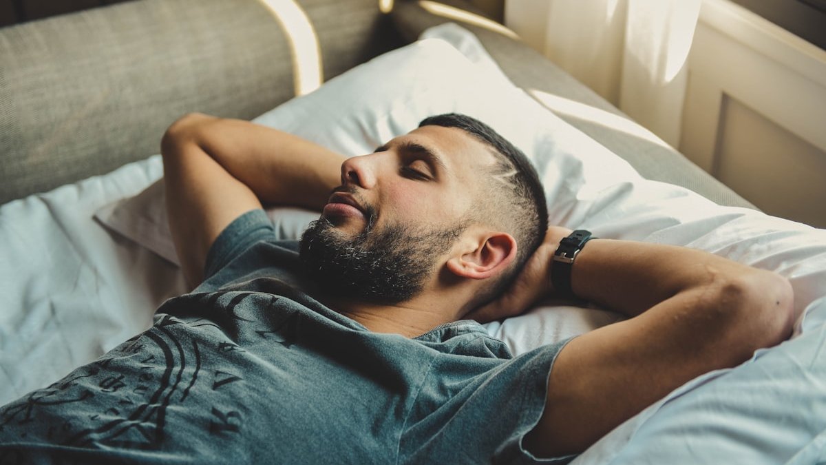 Man lying on bed. — a Sleep Finally guide to Waking Up Gasping for Air: What It Means.