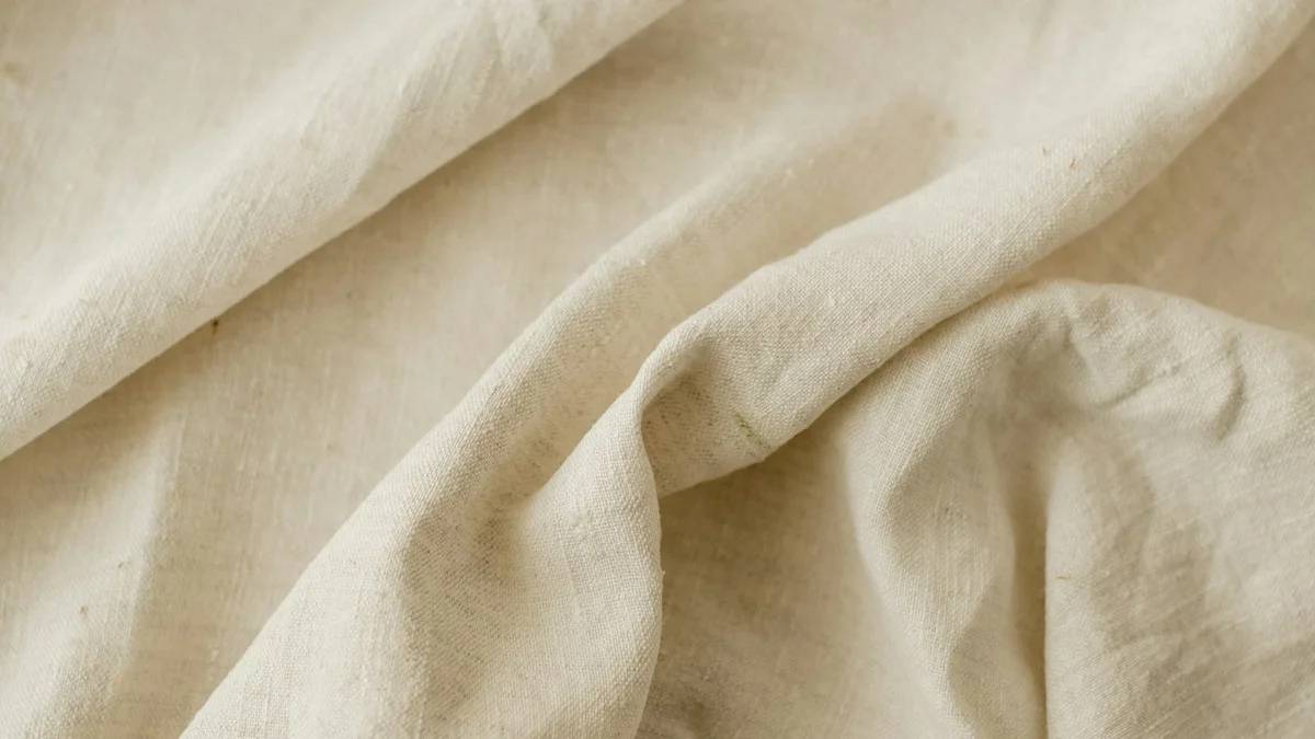 a close up of a bed with a white sheet — a Sleep, Finally guide to Why Consistency Beats a Perfect Bedtime Routine
