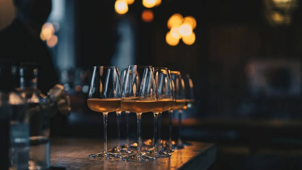 a group of glasses with liquid in them — a Sleep, Finally guide to Why Drinking Culture Makes Skipping a Drink Hard