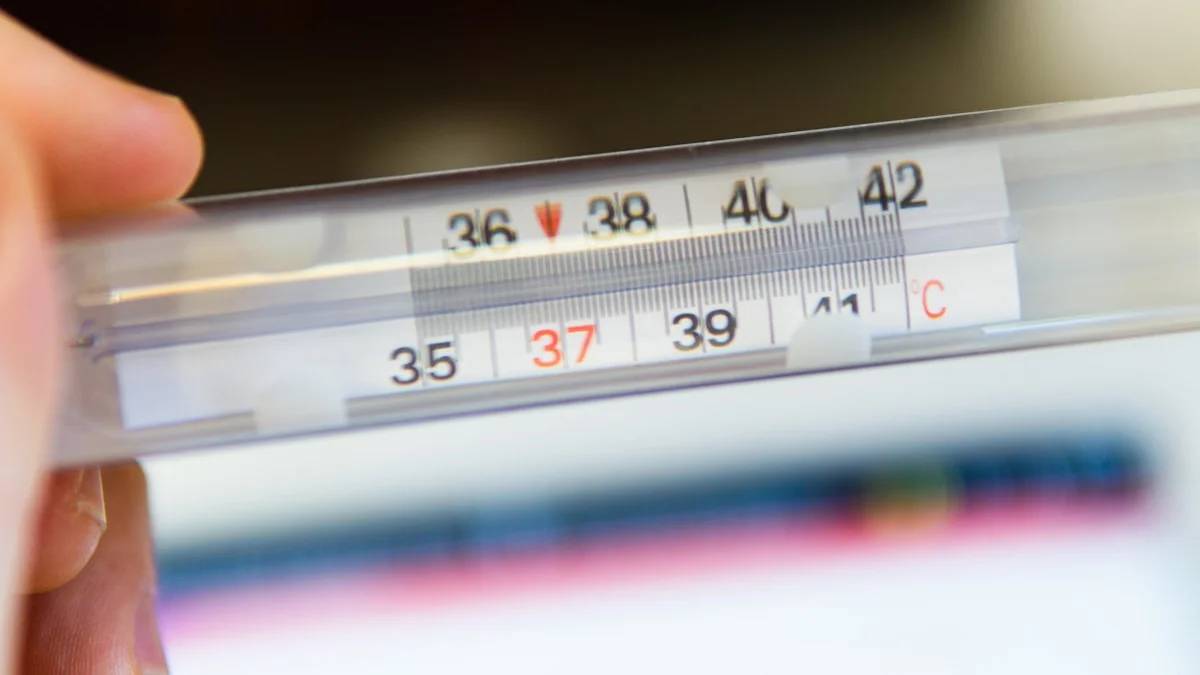 white thermometer at 36 degrees celsius — a Sleep, Finally guide to Your Cycle and Nighttime Body Temperature, Explained